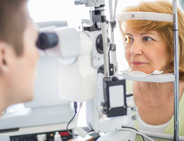 A woman getting an eye exam
